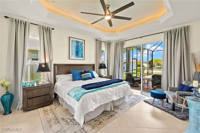 1206 SW 18th Ave, Cape Coral, FL 33991 - bedroom with a tray ceiling, access to outside, tile patterned floors, ornamental molding, and ceiling fan