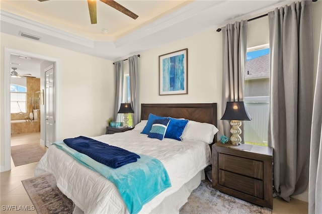 1206 SW 18th Ave, Cape Coral, FL 33991 - tiled bedroom featuring ornamental molding, a raised ceiling, connected bathroom, and ceiling fan