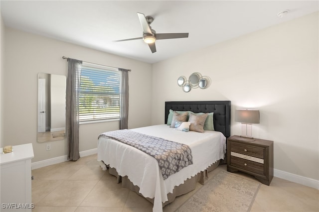 1206 SW 18th Ave, Cape Coral, FL 33991 - bedroom featuring baseboards, light tile patterned floors, and ceiling fan