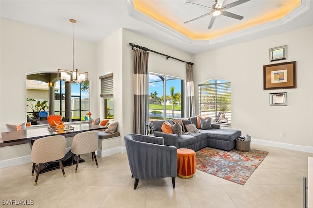 1206 SW 18th Ave, Cape Coral, FL 33991 - tiled living area with a tray ceiling, a ceiling fan, baseboards, and a towering ceiling