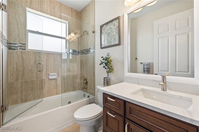 1206 SW 18th Ave, Cape Coral, FL 33991 - full bath featuring vanity, toilet, and combined bath / shower with glass door