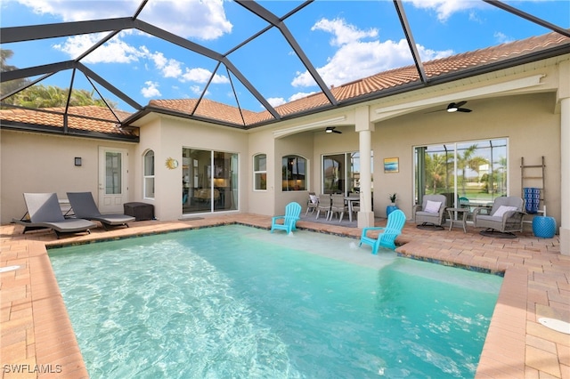 1206 SW 18th Ave, Cape Coral, FL 33991 - swimming pool featuring a ceiling fan, a patio area, and glass enclosure