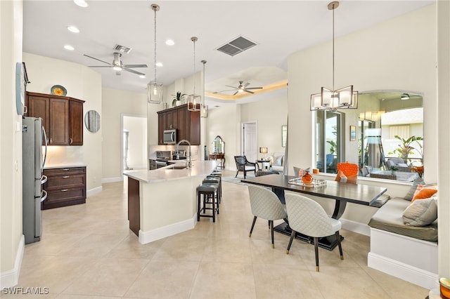 1206 SW 18th Ave, Cape Coral, FL 33991 - dining area with ceiling fan, recessed lighting, baseboards, and light tile patterned floors