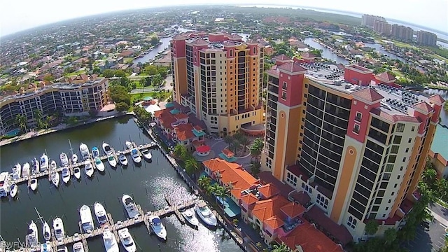 1206 SW 18th Ave, Cape Coral, FL 33991 - bird's eye view of numerous boat docks, a nearby body of water, and apartment complex
