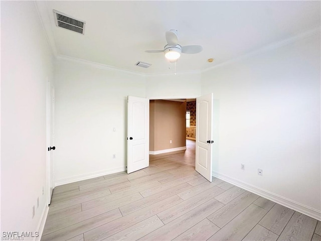 8088 Sanctuary Dr Unit 1, Naples, FL 34104 - unfurnished room with crown molding, a ceiling fan, light wood finished floors, and baseboards