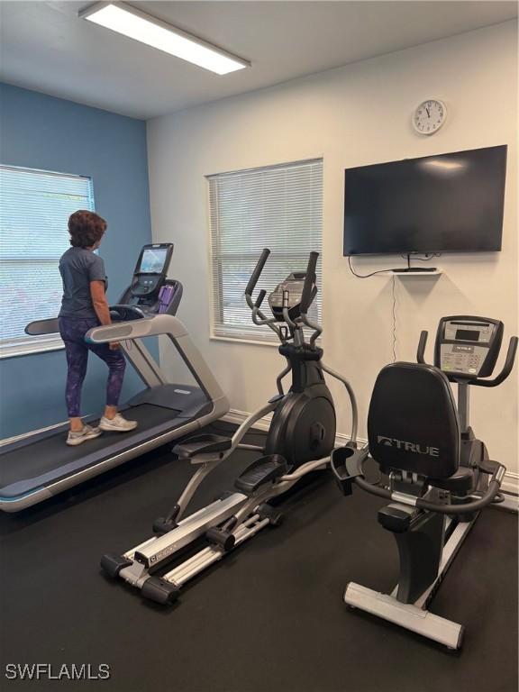 8088 Sanctuary Dr Unit 1, Naples, FL 34104 - gym featuring healthy amount of natural light and baseboards