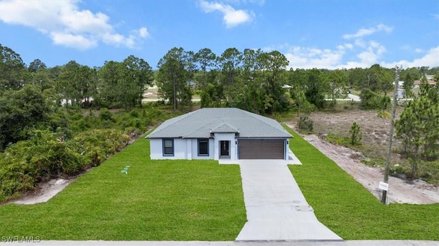 1032 Maxwell Ave S, Lehigh Acres, FL 33974 - view of front facade with a front lawn, driveway, an attached garage, and stucco siding