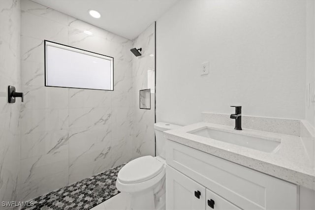 1032 Maxwell Ave S, Lehigh Acres, FL 33974 - full bath featuring vanity, toilet, and a marble finish shower