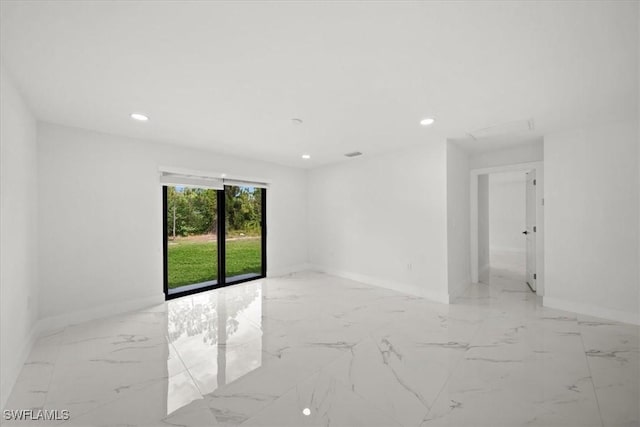 1032 Maxwell Ave S, Lehigh Acres, FL 33974 - unfurnished room with baseboards, light marble finish flooring, and recessed lighting