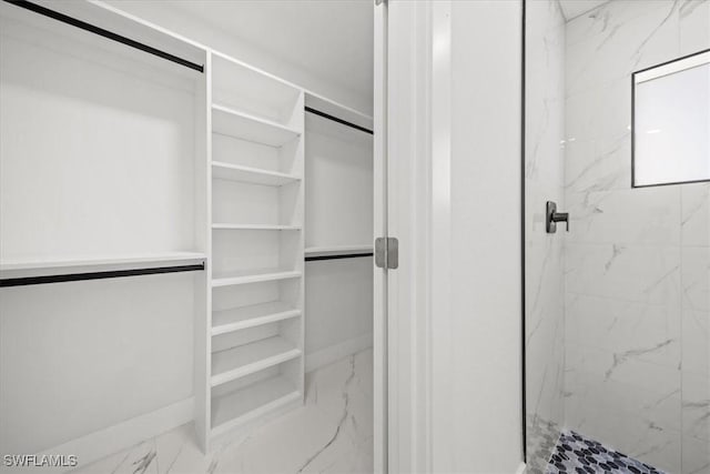 1032 Maxwell Ave S, Lehigh Acres, FL 33974 - walk in closet with marble look tile flooring