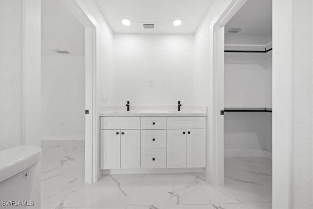 1032 Maxwell Ave S, Lehigh Acres, FL 33974 - bathroom featuring marble finish floors, toilet, a spacious closet, recessed lighting, and baseboards