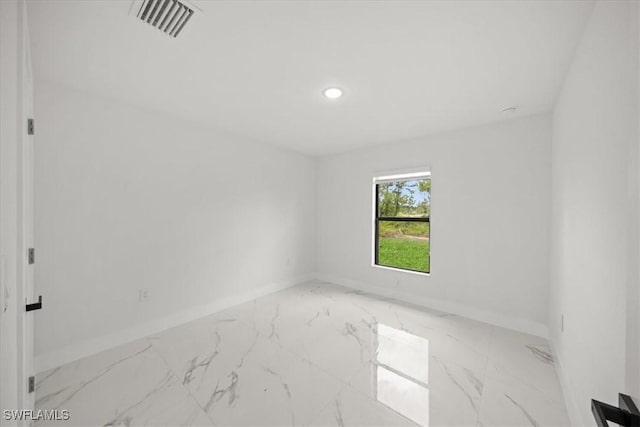 1032 Maxwell Ave S, Lehigh Acres, FL 33974 - spare room with baseboards, light marble finish flooring, and recessed lighting