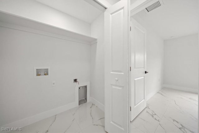 1032 Maxwell Ave S, Lehigh Acres, FL 33974 - laundry room with hookup for a washing machine, light marble finish floors, and baseboards