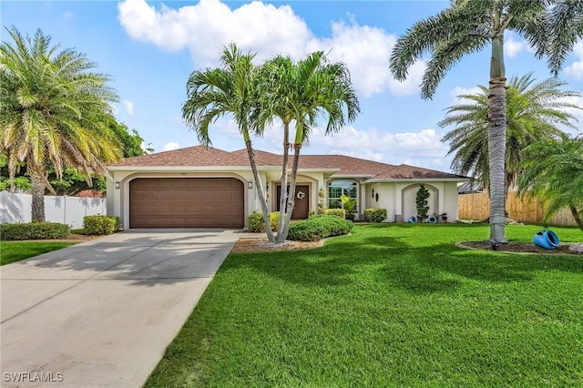 907 SE 19th Ter, Cape Coral, FL 33990 - view of front of home featuring an attached garage, stucco siding, and driveway