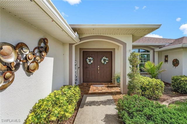 907 SE 19th Ter, Cape Coral, FL 33990 - entrance to property featuring stucco siding and a shingled roof