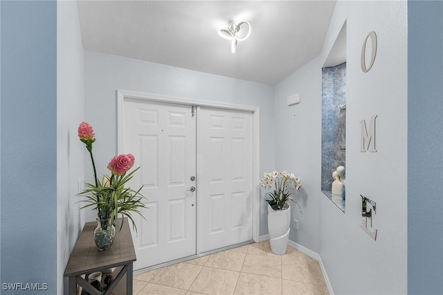 907 SE 19th Ter, Cape Coral, FL 33990 - entryway with light tile patterned flooring and baseboards