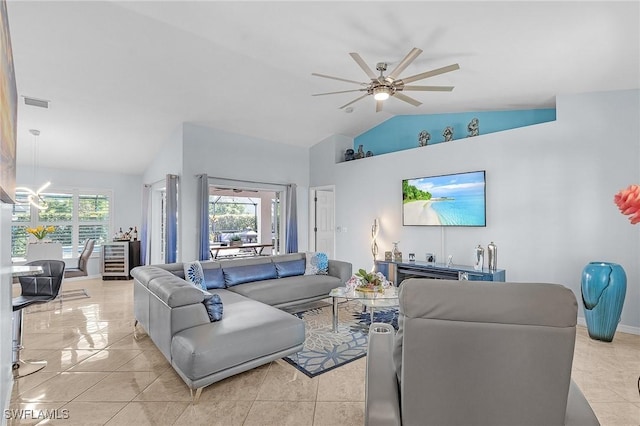 907 SE 19th Ter, Cape Coral, FL 33990 - living room featuring vaulted ceiling, a chandelier, ceiling fan, and light tile patterned flooring