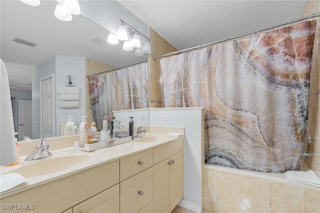 907 SE 19th Ter, Cape Coral, FL 33990 - bathroom featuring double vanity and curtained shower