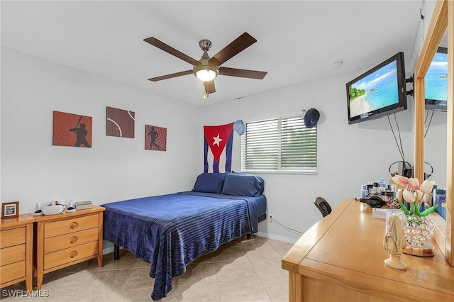 907 SE 19th Ter, Cape Coral, FL 33990 - bedroom with light tile patterned floors and ceiling fan