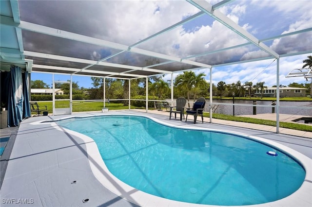 399 Grenier Dr, North Fort Myers, FL 33903 - swimming pool featuring a patio area, a water view, and glass enclosure