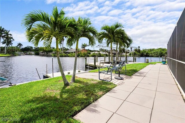 399 Grenier Dr, North Fort Myers, FL 33903 - dock featuring a yard, a water view, and boat lift