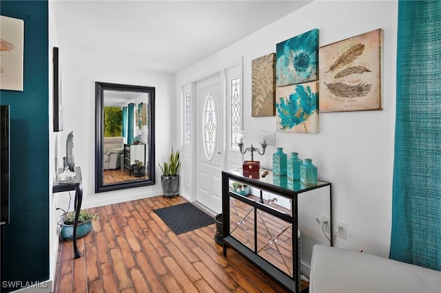 399 Grenier Dr, North Fort Myers, FL 33903 - foyer featuring wood finished floors