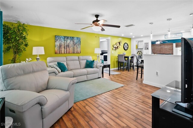399 Grenier Dr, North Fort Myers, FL 33903 - living area featuring ceiling fan, wood finished floors, baseboards, and recessed lighting