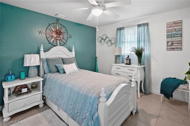 399 Grenier Dr, North Fort Myers, FL 33903 - bedroom with a ceiling fan and tile patterned floors