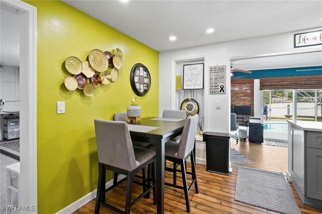 399 Grenier Dr, North Fort Myers, FL 33903 - dining area with wood finished floors, recessed lighting, and baseboards
