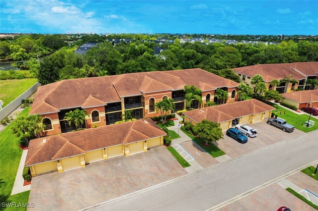 13751 Julias Way Unit 414, Fort Myers, FL 33919 - aerial view of property and surrounding area featuring a tree filled landscape