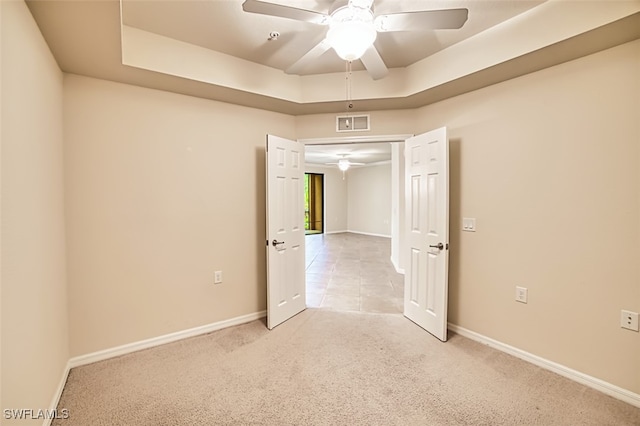 13751 Julias Way Unit 414, Fort Myers, FL 33919 - carpeted spare room with a ceiling fan, a raised ceiling, and baseboards