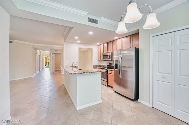 13751 Julias Way Unit 414, Fort Myers, FL 33919 - kitchen featuring appliances with stainless steel finishes, crown molding, light tile patterned floors, light stone counters, and baseboards