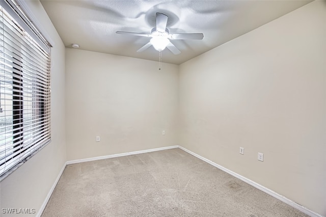 13751 Julias Way Unit 414, Fort Myers, FL 33919 - unfurnished room featuring a ceiling fan, light colored carpet, and baseboards
