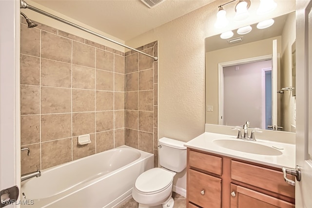 13751 Julias Way Unit 414, Fort Myers, FL 33919 - bathroom featuring a textured wall, toilet, vanity, and shower / bath combination