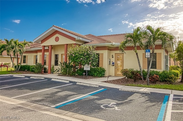 13751 Julias Way Unit 414, Fort Myers, FL 33919 - view of building exterior featuring uncovered parking
