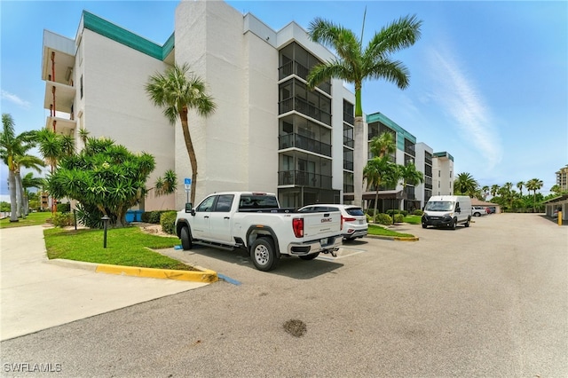 3460 N Key Dr Unit 409, North Fort Myers, FL 33903 - view of apartment building / complex with uncovered parking