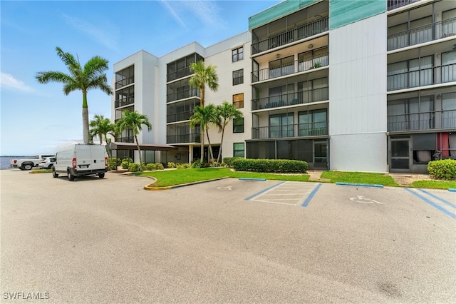 3460 N Key Dr Unit 409, North Fort Myers, FL 33903 - view of apartment building / complex with uncovered parking