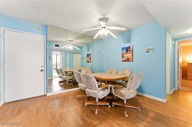 3460 N Key Dr Unit 409, North Fort Myers, FL 33903 - dining space with light wood finished floors, ceiling fan, and baseboards