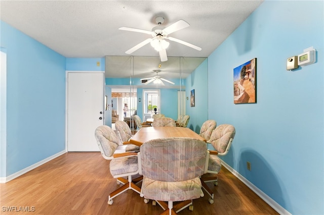 3460 N Key Dr Unit 409, North Fort Myers, FL 33903 - dining area with wood finished floors, ceiling fan, and baseboards