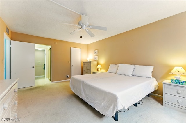 3460 N Key Dr Unit 409, North Fort Myers, FL 33903 - bedroom featuring light carpet, baseboards, and ceiling fan