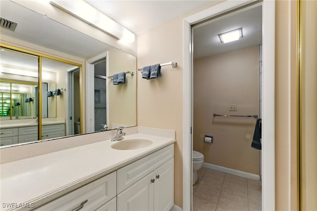 3460 N Key Dr Unit 409, North Fort Myers, FL 33903 - bathroom with toilet, tile patterned flooring, vanity, and baseboards