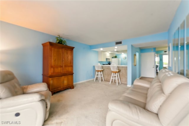 3460 N Key Dr Unit 409, North Fort Myers, FL 33903 - living area featuring light colored carpet and baseboards
