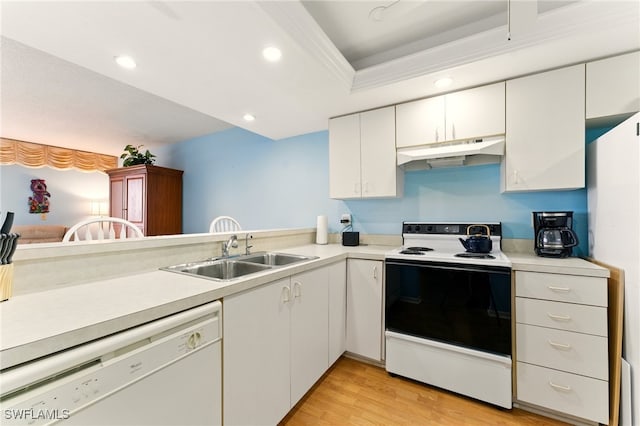 3460 N Key Dr Unit 409, North Fort Myers, FL 33903 - kitchen with white appliances, under cabinet range hood, a sink, light countertops, and recessed lighting