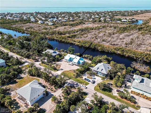 785 Rabbit Rd, Sanibel, FL 33957 - aerial perspective of suburban area with a large body of water