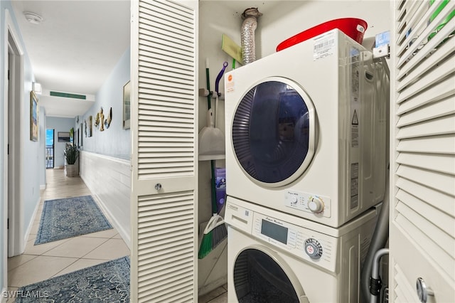 1920 Virginia Ave Unit 102, Fort Myers, FL 33901 - laundry room with stacked washer and clothes dryer and tile patterned floors
