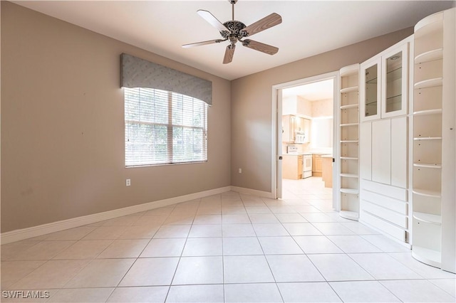 793 Regency Reserve Cir Unit 4501, Naples, FL 34119 - empty room with ceiling fan and light tile patterned flooring