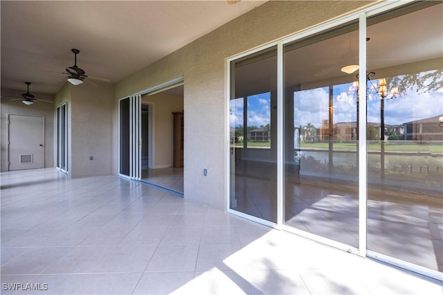 793 Regency Reserve Cir Unit 4501, Naples, FL 34119 - view of patio / terrace featuring ceiling fan and a water view