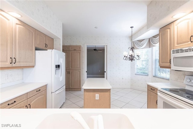 793 Regency Reserve Cir Unit 4501, Naples, FL 34119 - kitchen featuring white appliances, wallpapered walls, light brown cabinets, a center island, and light tile patterned floors