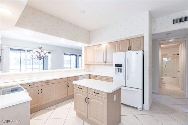 793 Regency Reserve Cir Unit 4501, Naples, FL 34119 - kitchen with white appliances, light brown cabinets, light tile patterned flooring, a center island, and a chandelier