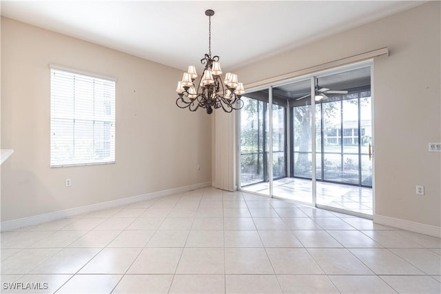 793 Regency Reserve Cir Unit 4501, Naples, FL 34119 - spare room featuring light tile patterned floors, a chandelier, and a ceiling fan